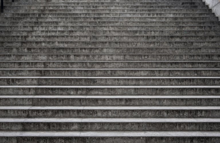 Ascending concrete steps illustrating rigorous organisational structure and project stability.