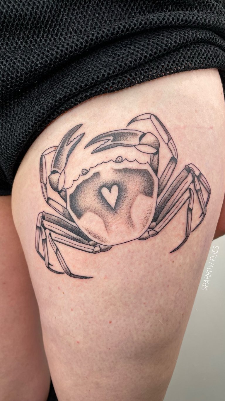 Old school crab tattoo design on the upper thigh