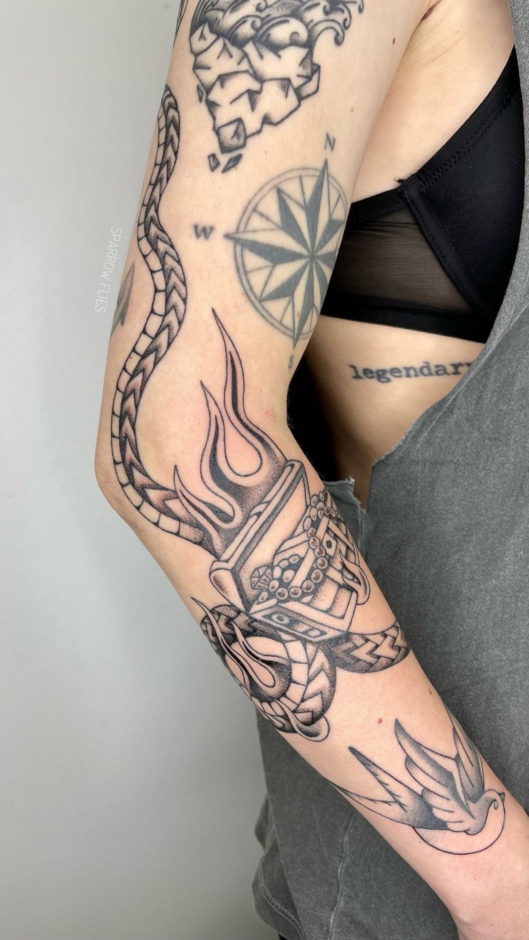 Treasure box with snake and flames tattoo in old school tattoo style