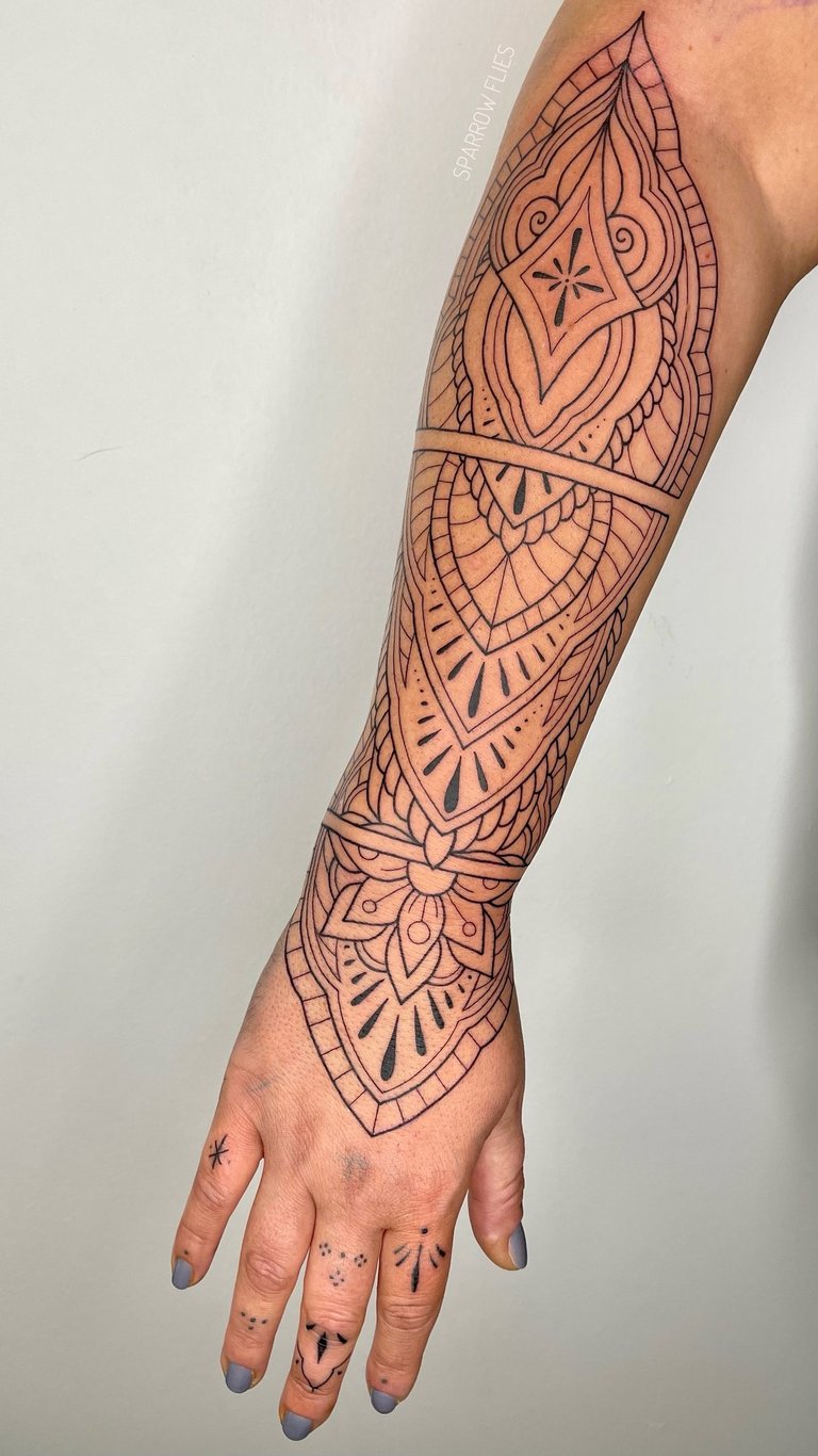 Ornamental tattoo piece on the forearm