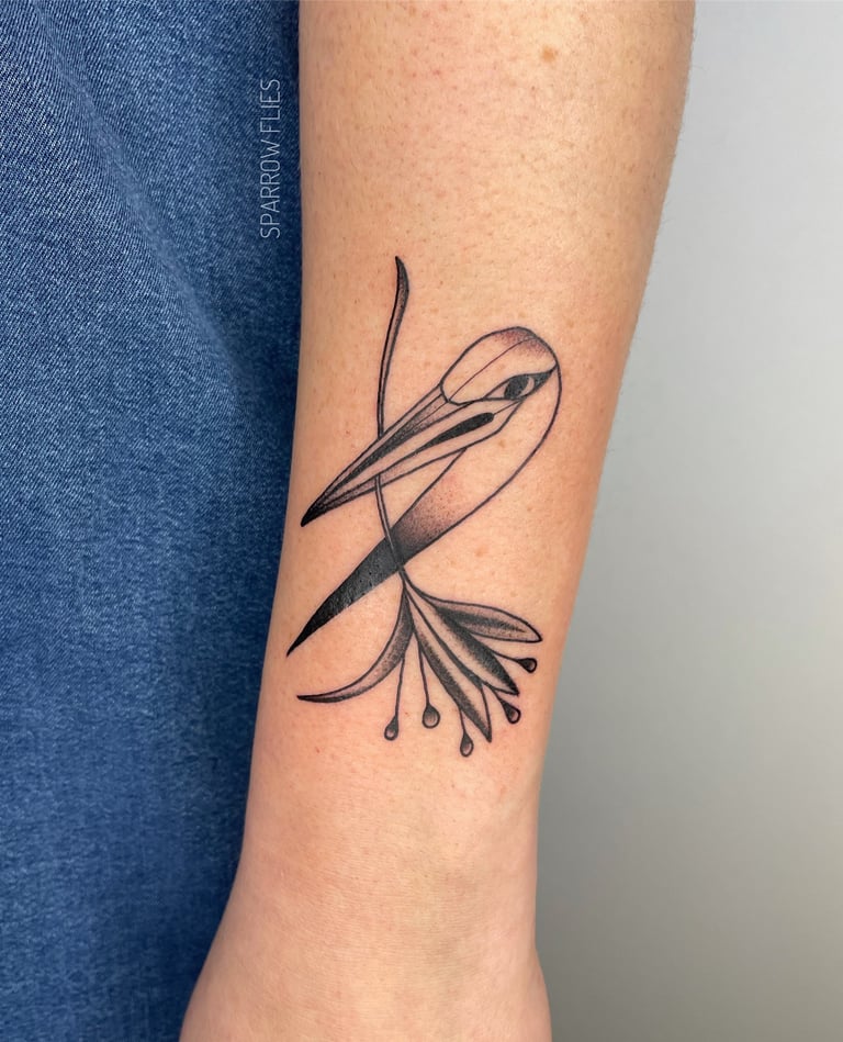 Blackwork crane with flower tattoo design