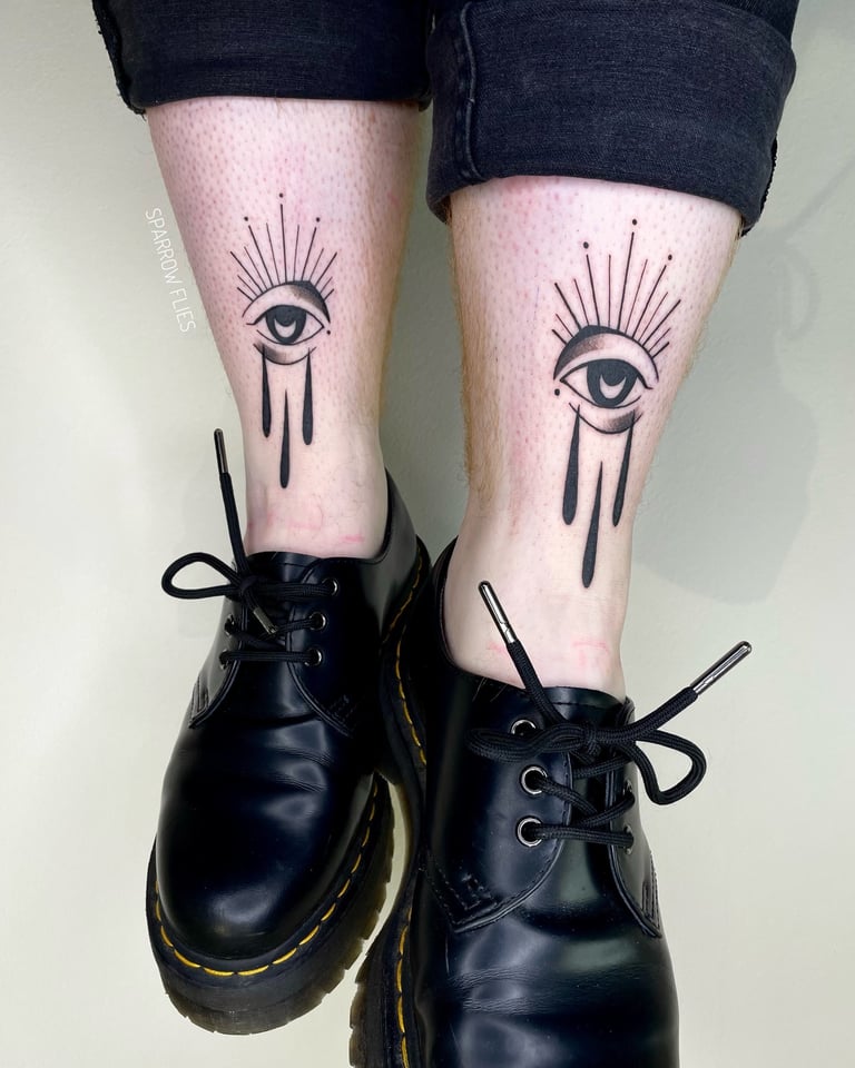 Black work eyes design on the front of ankles