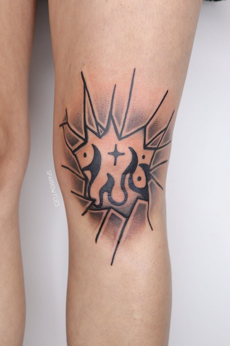 Old school blackwork knee tattoo with broken glass and fire with stars motive