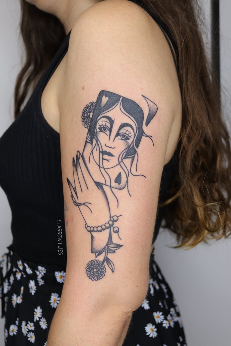 Blackwork traditional geisha, card and hand tattoo design made on upper arm by Agnė