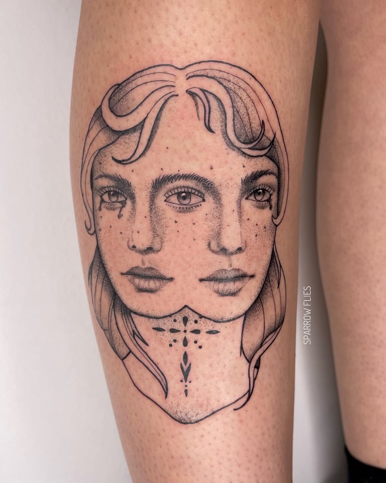 Fine-line double woman face tattoo in the shi 