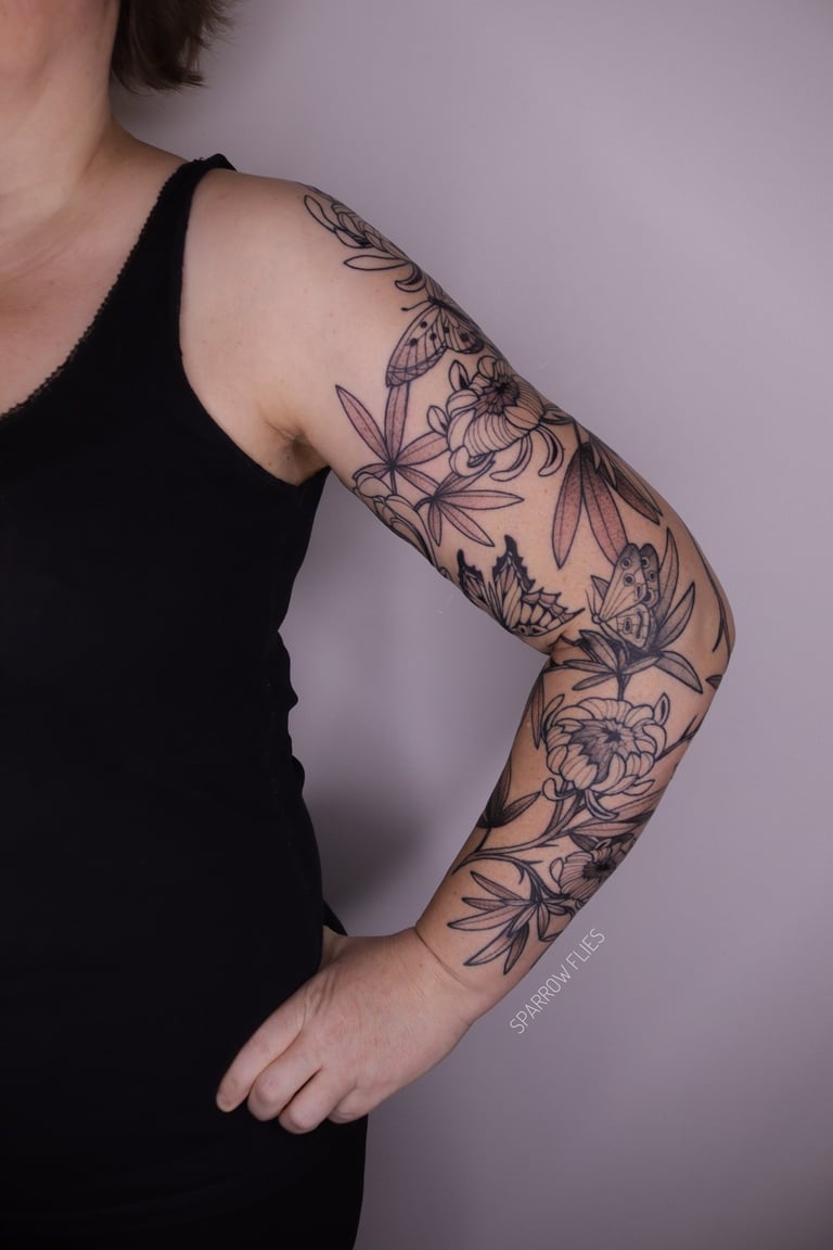 Floral tattoo sleeve with butterlies