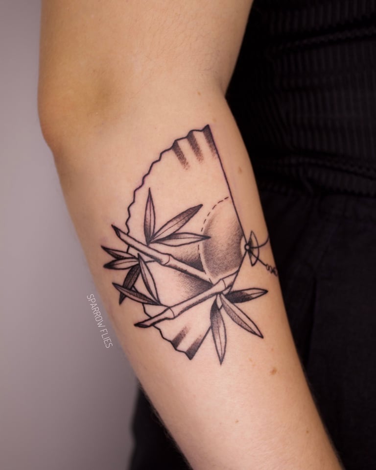 Neo-traditional fan with bamboos tattoo