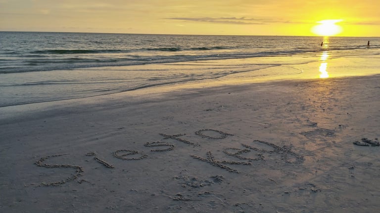 photo of the words Siesta Key written in the sand on Siesta Key