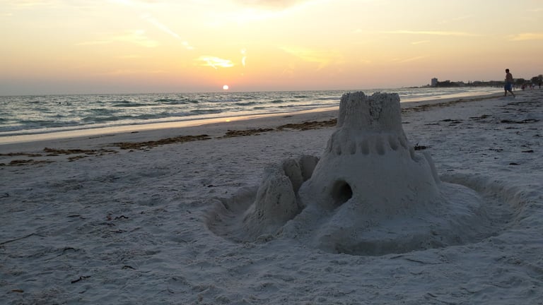 a sandcastle on Siesta Beach at sunset near Crescent Beach