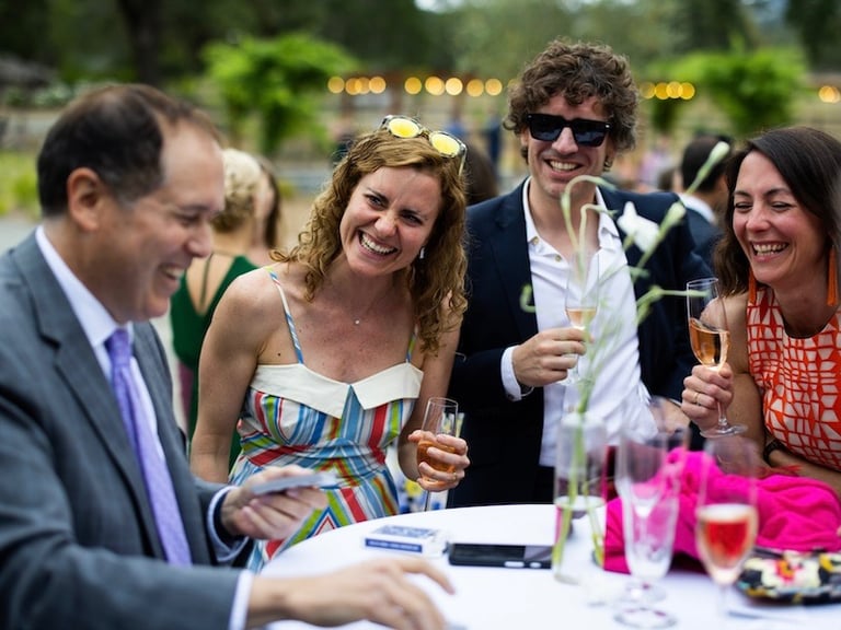 San Jose Magician David Martinez performs close-up magic for a laughing crowd