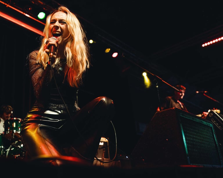 a singer performing on a dark stage