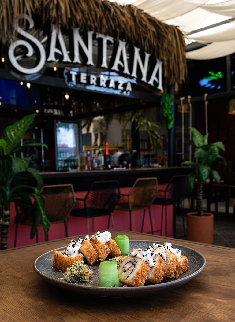 Plate of gourmet tempura sushi rolls served at Santana Terraza outdoor bar and restaurant.