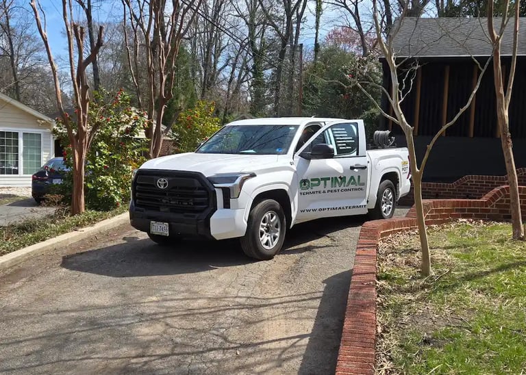 an image of a company vehicle for optimal termite & pest control in a richmond va neighborhood