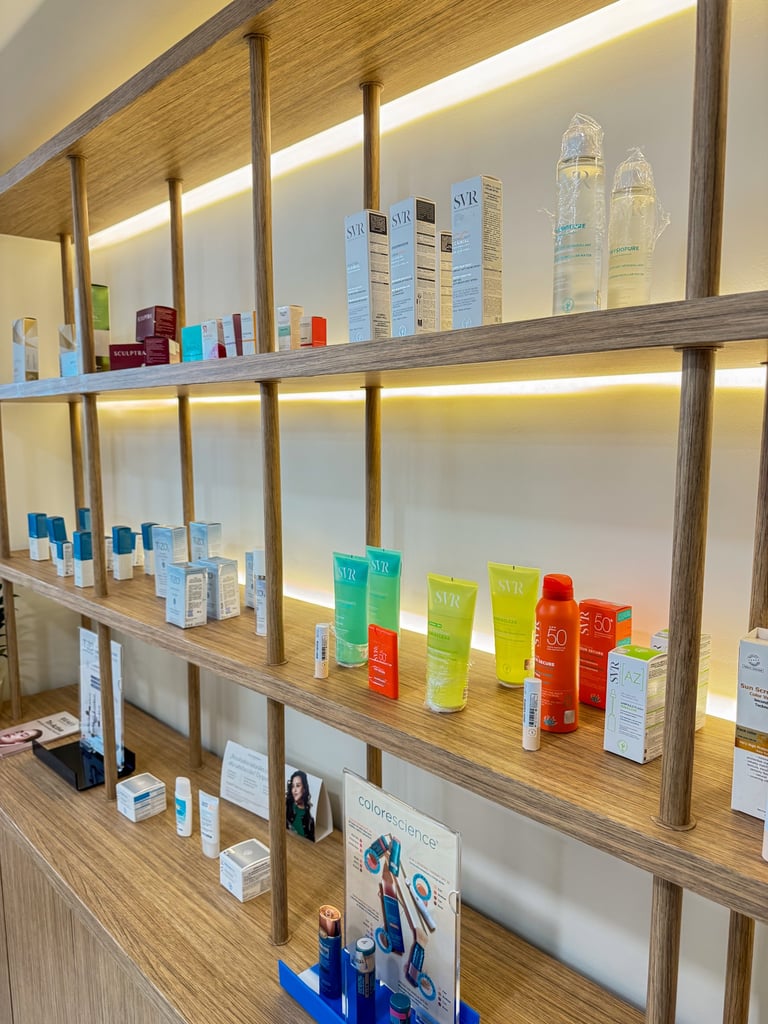 Professional skincare products and sunscreen displays on wooden shelves in a modern dermatology clinic.