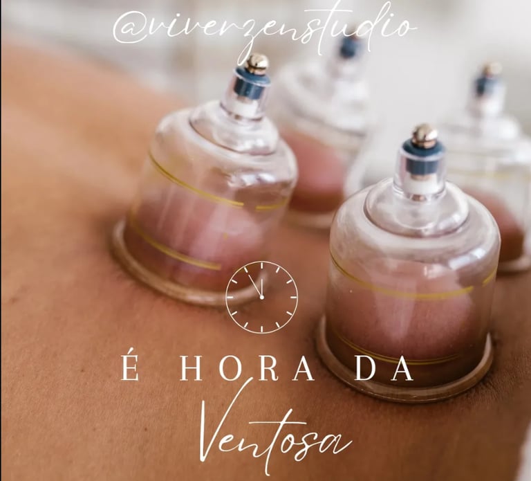 Professional cupping therapy session showing glass cups applied to a patient's back for muscle recovery.