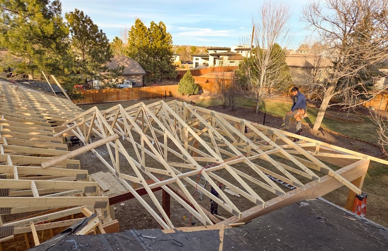 Close-up of intricate roof truss framing on a custom residential build by Elk Valley Contractors.