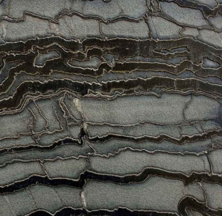 A close-up of a textured black and grey marble natural stone