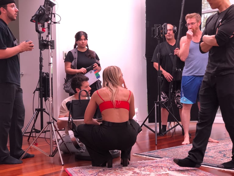 many people on set with lights and monitors