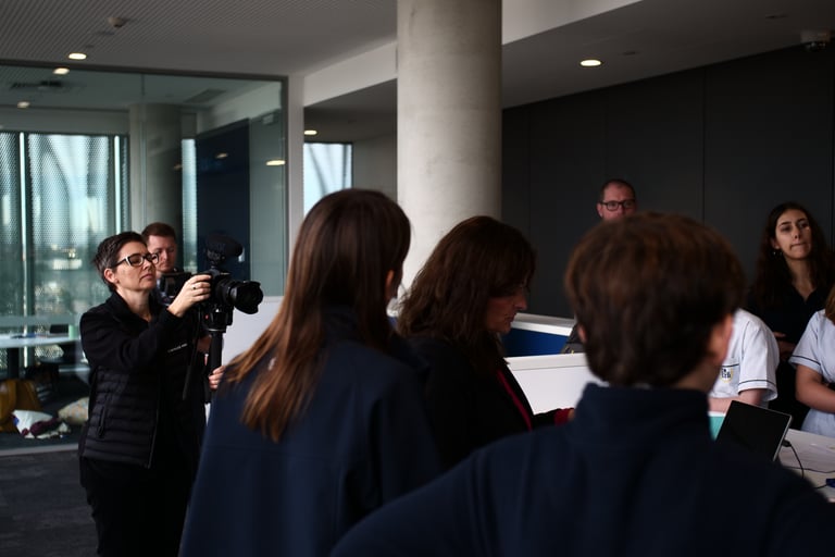 someone filming students in a library