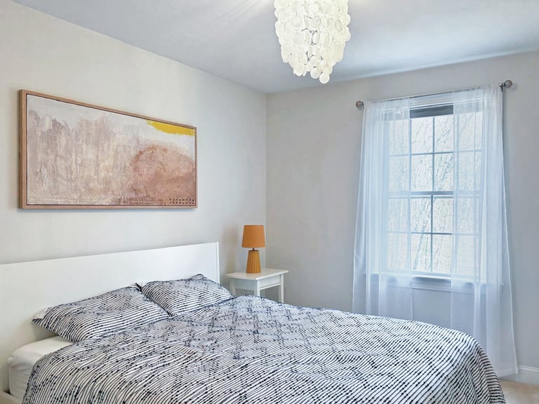 Guest room, capiz chandelier, abstract painting, sheer curtains, interior renovation Lancaster MA, Erica Fossati Design
