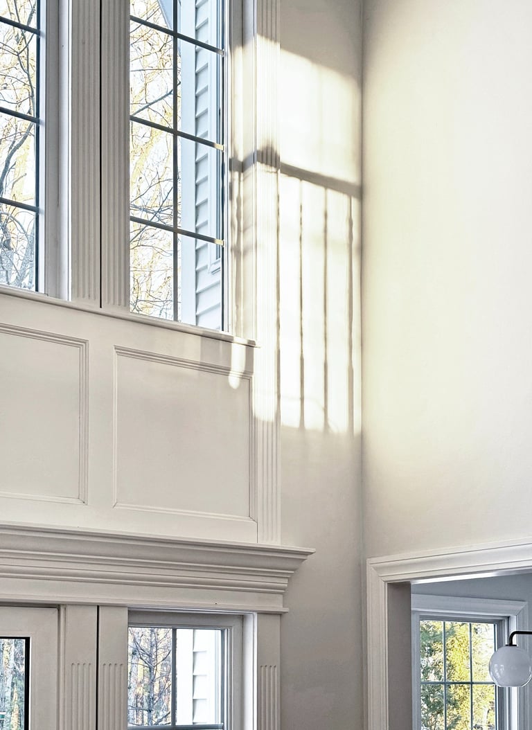 Custom trim detail, double height windows, natural light, colonial home renovation Lancaster MA, Erica Fossati Design
