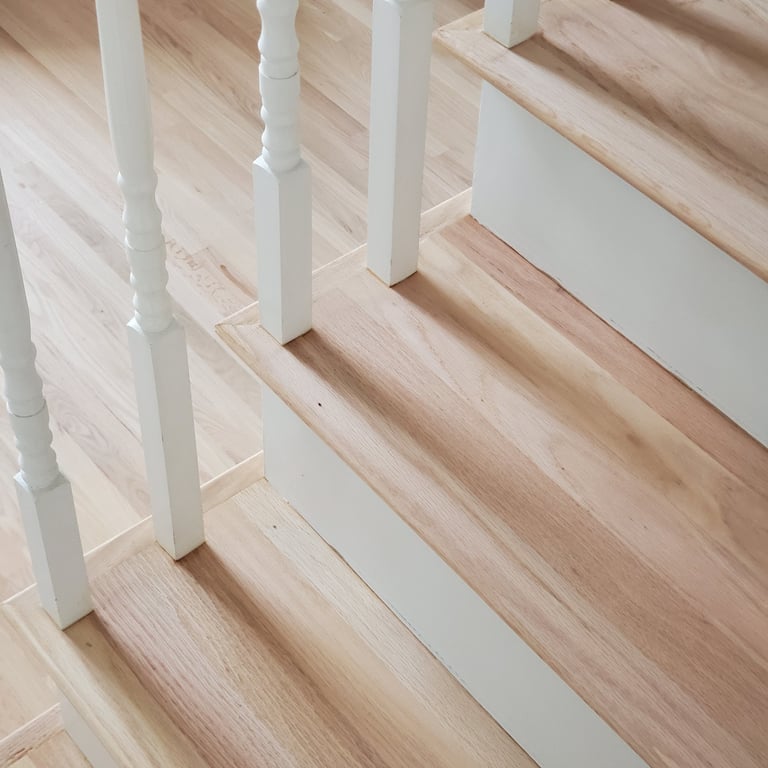 Refinished red oak stair treads, painted balusters, hardwood floor refinishing Lancaster MA, Erica Fossati Design