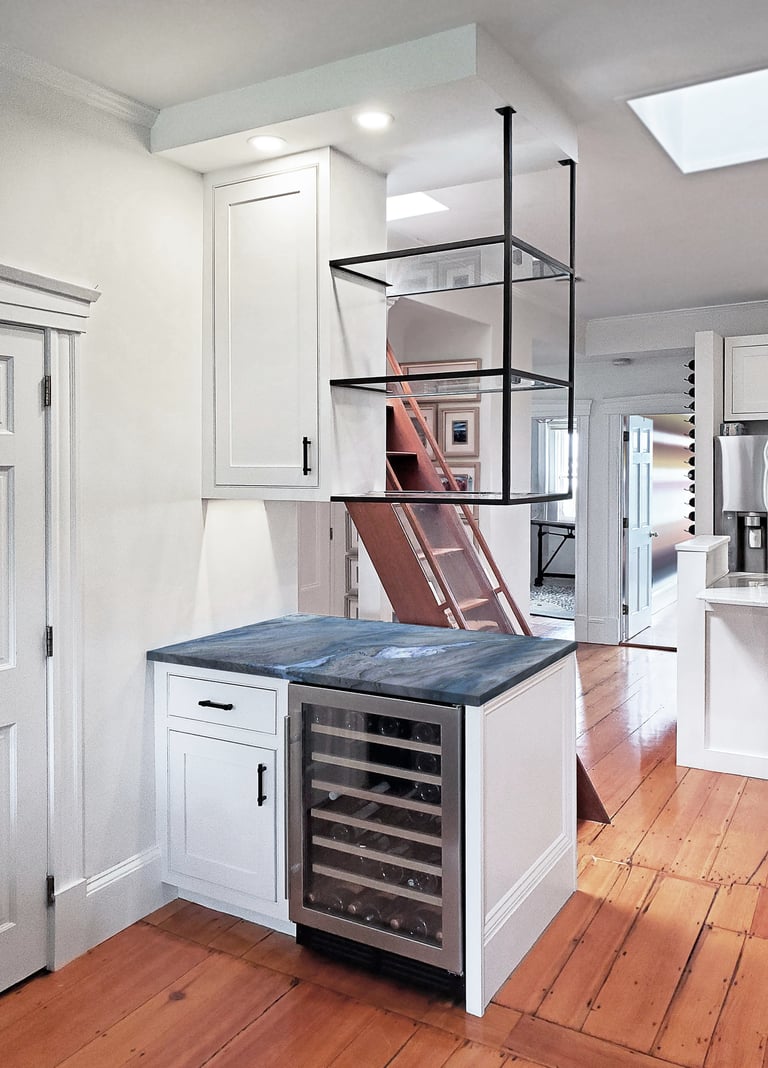 Custom bar, cobalt quartzite counter, black steel glass shelving, historic rowhouse Charlestown Boston