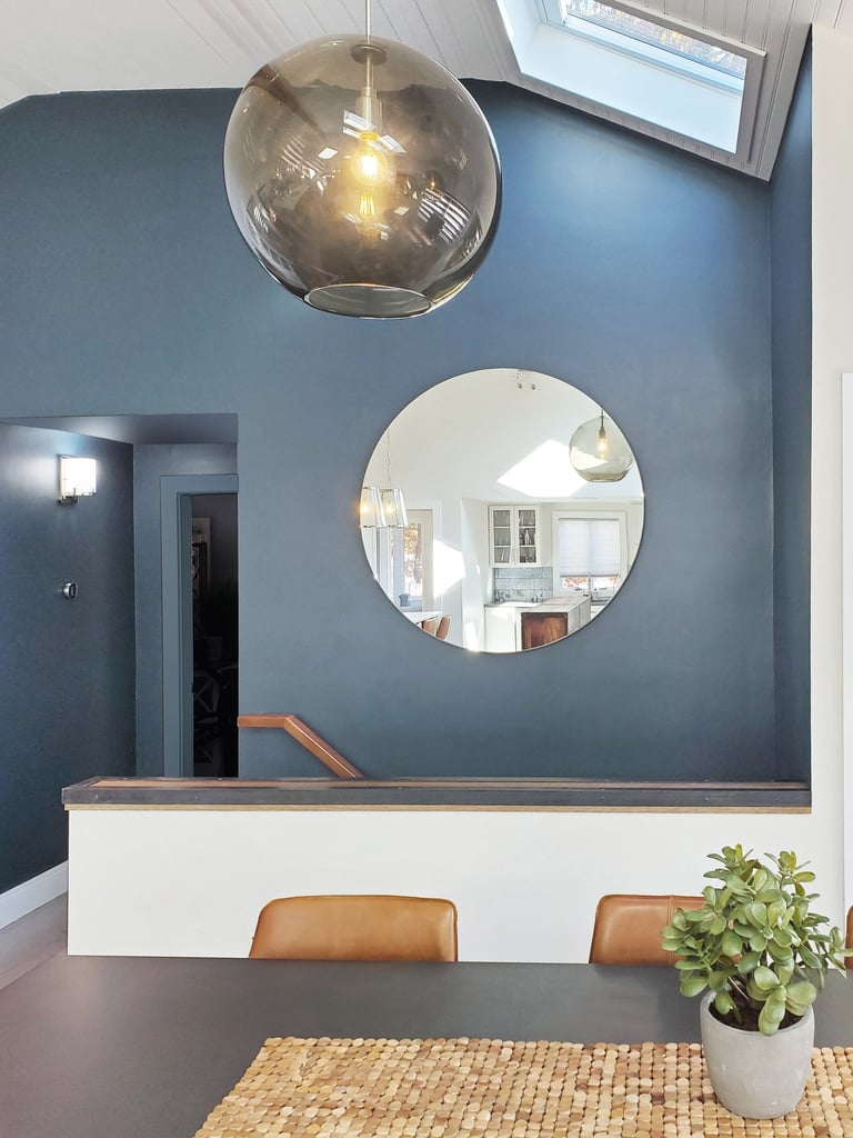 Dining area detail, teal accent wall, round mirror, smoked glass pendant, Greater Boston, Erica Fossati Design