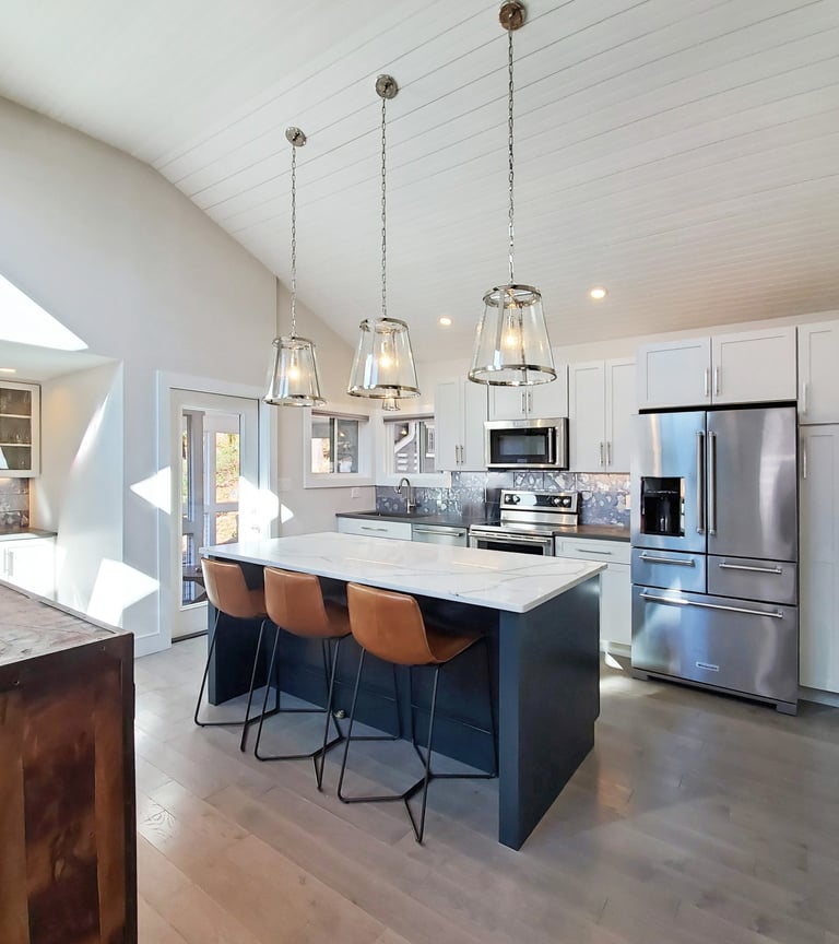 Kitchen renovation, navy island, marble countertop, glass pendants, cathedral ceiling, Erica Fossati Design Greater Boston