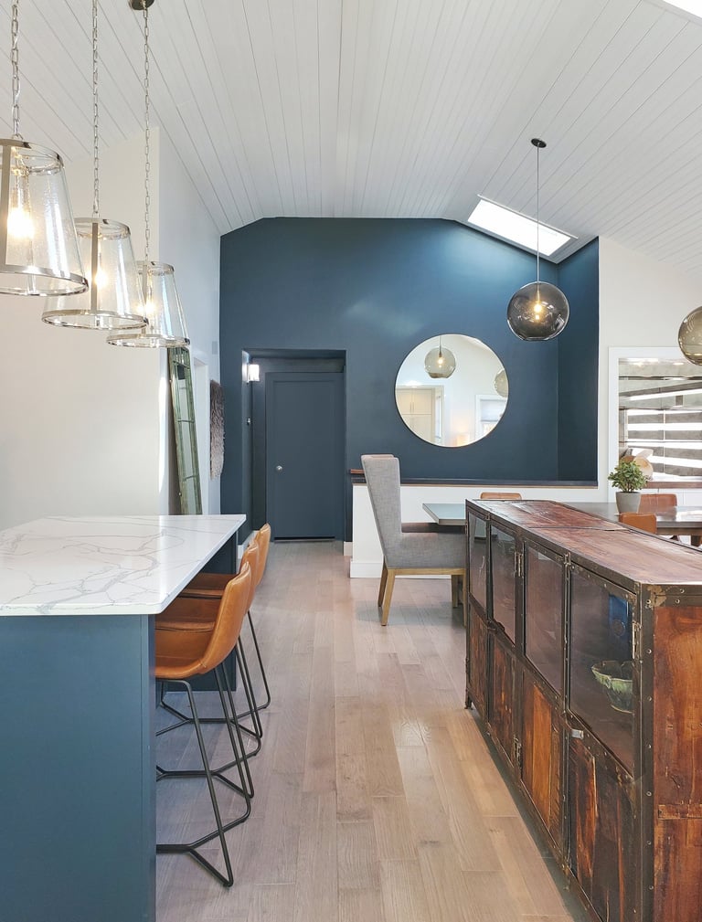 Kitchen to dining view, navy island, industrial cabinet, teal accent wall, Medford MA New England