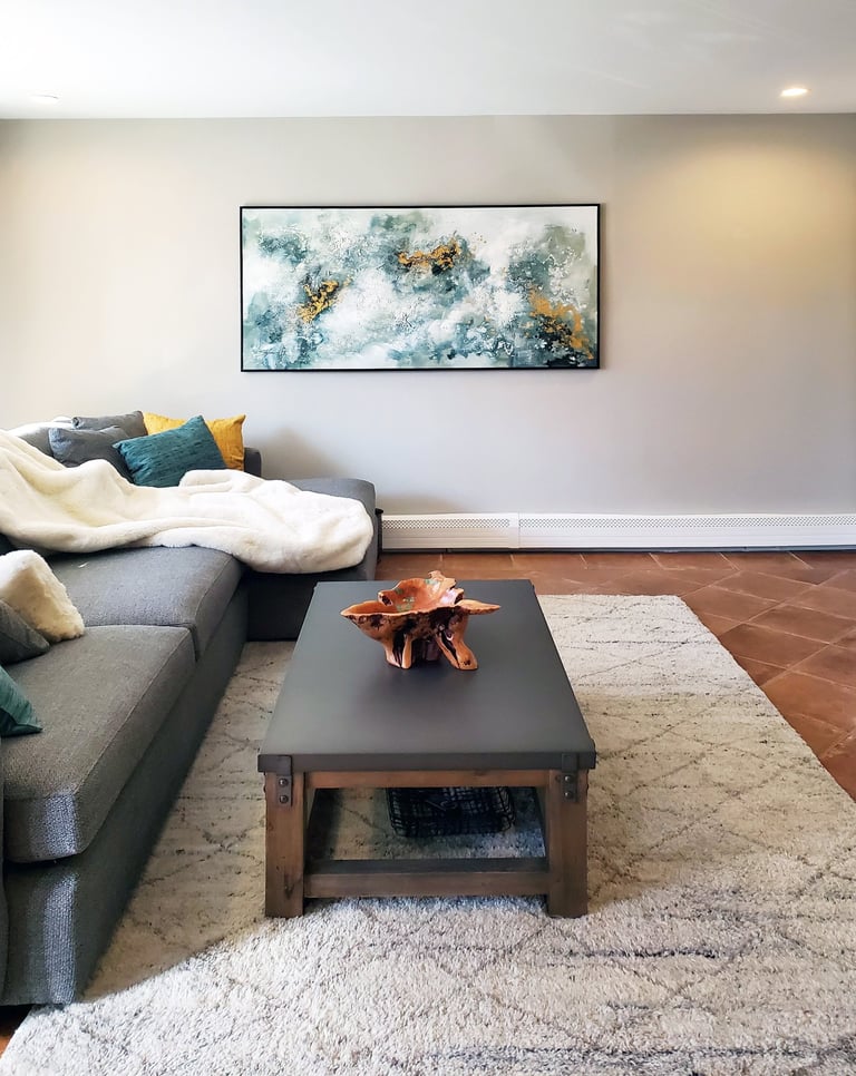 Lower level family room, sectional sofa, abstract painting, cotto tile floor, New England, Erica Fossati Design