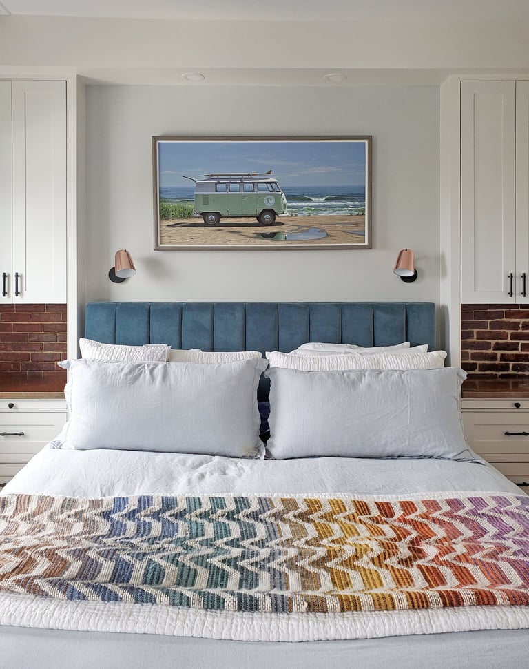 Primary bedroom, blue velvet headboard, custom built-ins, exposed brick, Charlestown Boston MA