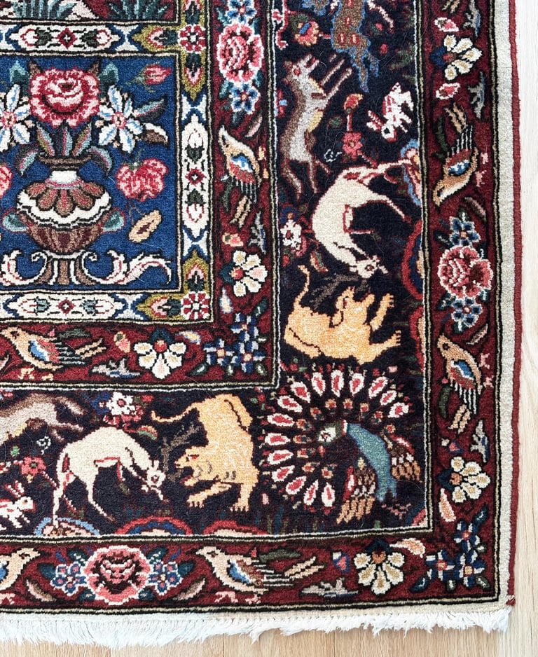 Vintage Persian Bakhtiari rug detail, animal and floral motifs, curated interior design Lancaster MA