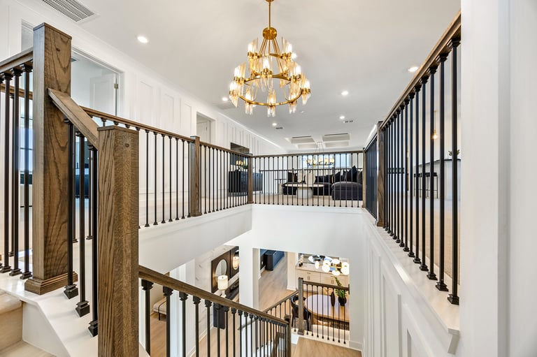 Two-story home with modern staircase and chandelier