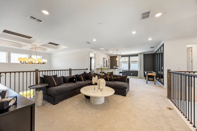 Spacious upstairs bonus room in Tampa, FL with plush carpeting and versatile layout for home office or entertainment