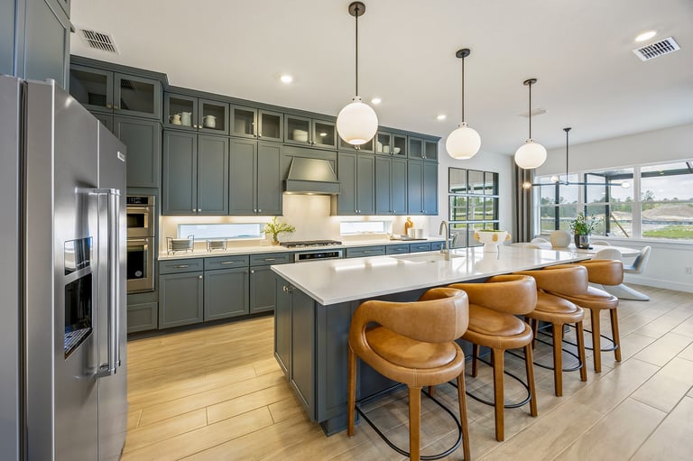 Spacious modern kitchen with quartz countertops and stainless steel appliances