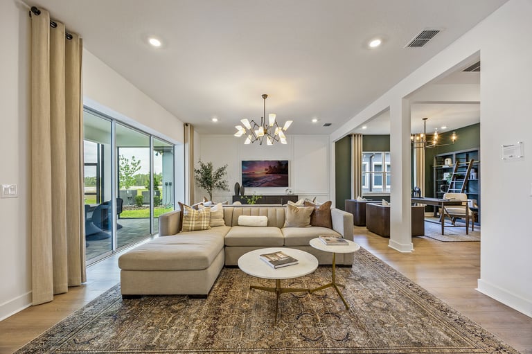 Bright open-concept living room with floor-to-ceiling windows