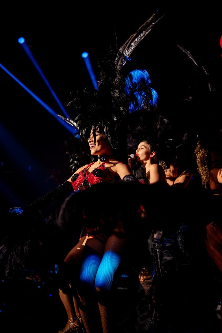 Feather Dancers with blue spotlights, Hosting Dinner Show, Scandal Dubai Hilton | NBmore