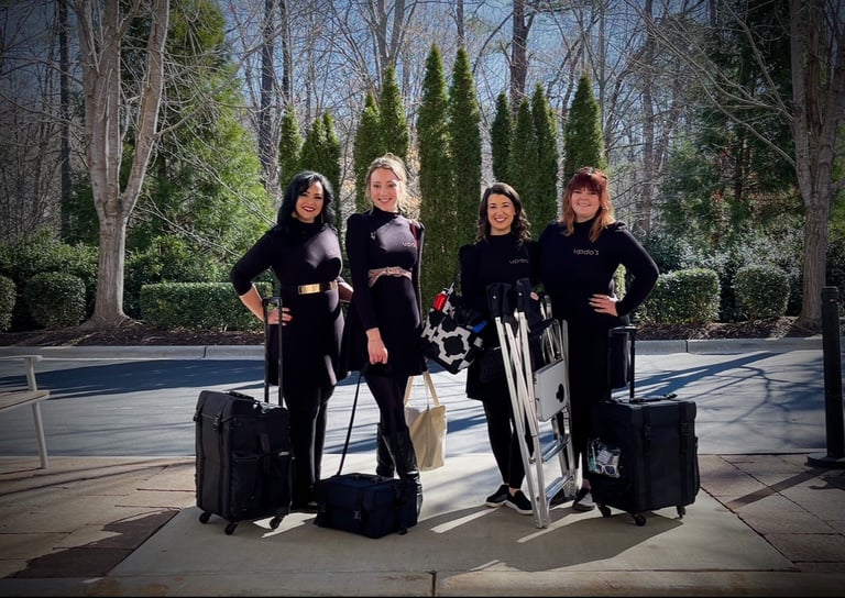 Updo's Studio hair and makeup team arrives on site with kits and chairs, ready to provide on site wedding beauty services.