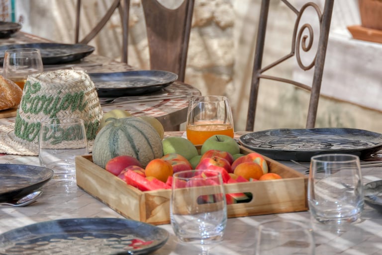 Charming terrace dining spot at Mas L'Enclos du Soleil le Vent in Drôme Provençale, ideal for al fresco meals