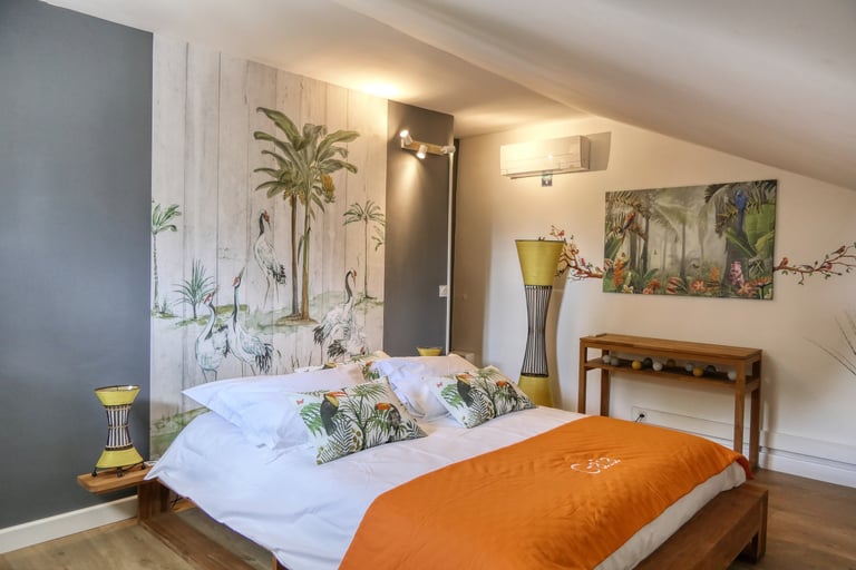 Prestigious Gaïa suite in Drôme Provençale, a refined holiday bedroom offering comfort and elegance in l'Enclos du Soleil le