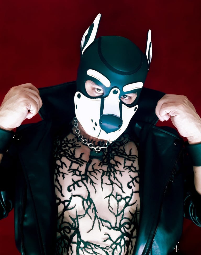 A man poses in pup mask.