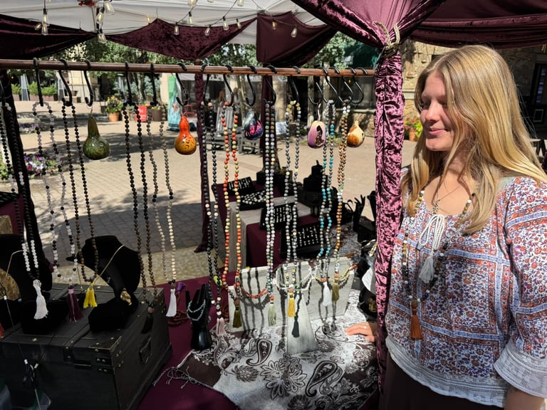 Lauren with her Malas in the Bhav Booth