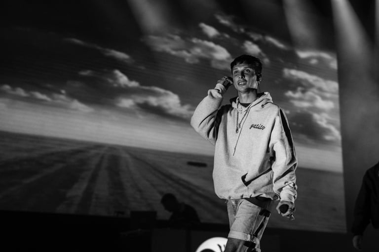 Black and white image of a Ayax & Prok in a hoodie performing at SONORAMA RIBERA in Bilbao. Live music event.