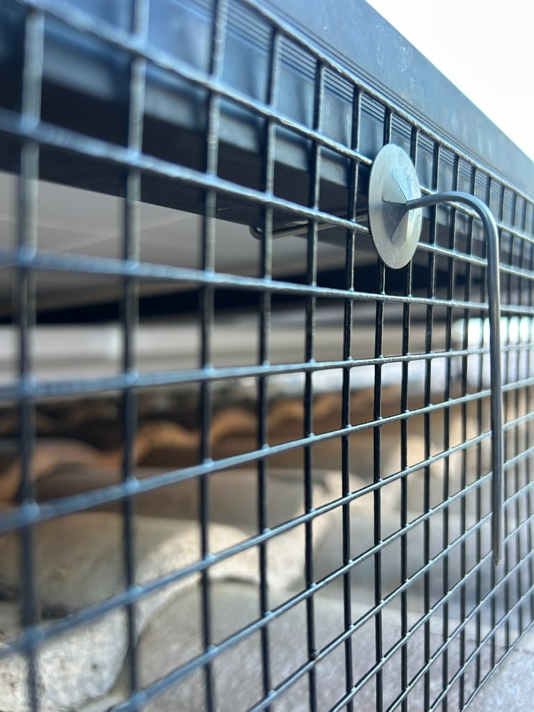 Solar panel bird proofing mesh installed along panel edge in Phoenix AZ secured with J-hook clips