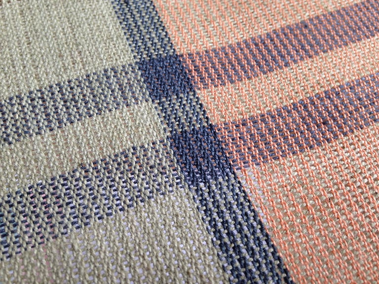 Gros plan d'un textile tissé main.