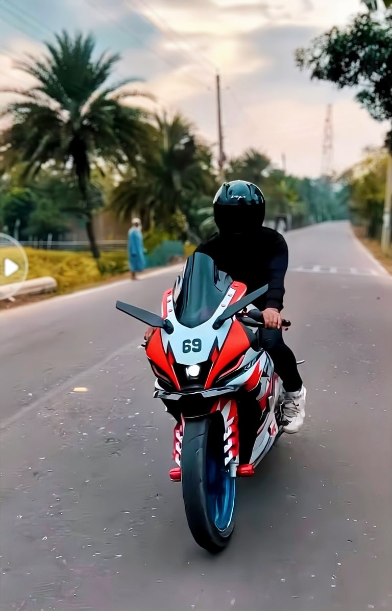 A rider on a custom red and white Yamaha R15 sports bike on an open road with palm trees.