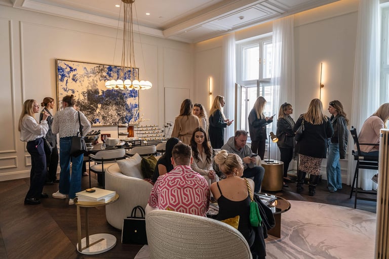 A modern interior room full of influencers at an event.