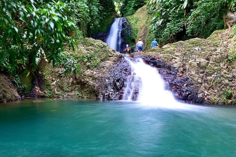 Tourists hiking to Seven Sisters Waterfall in Grenada
