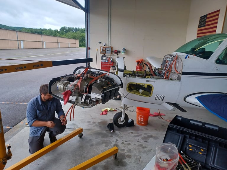 Mechanic installing an engine